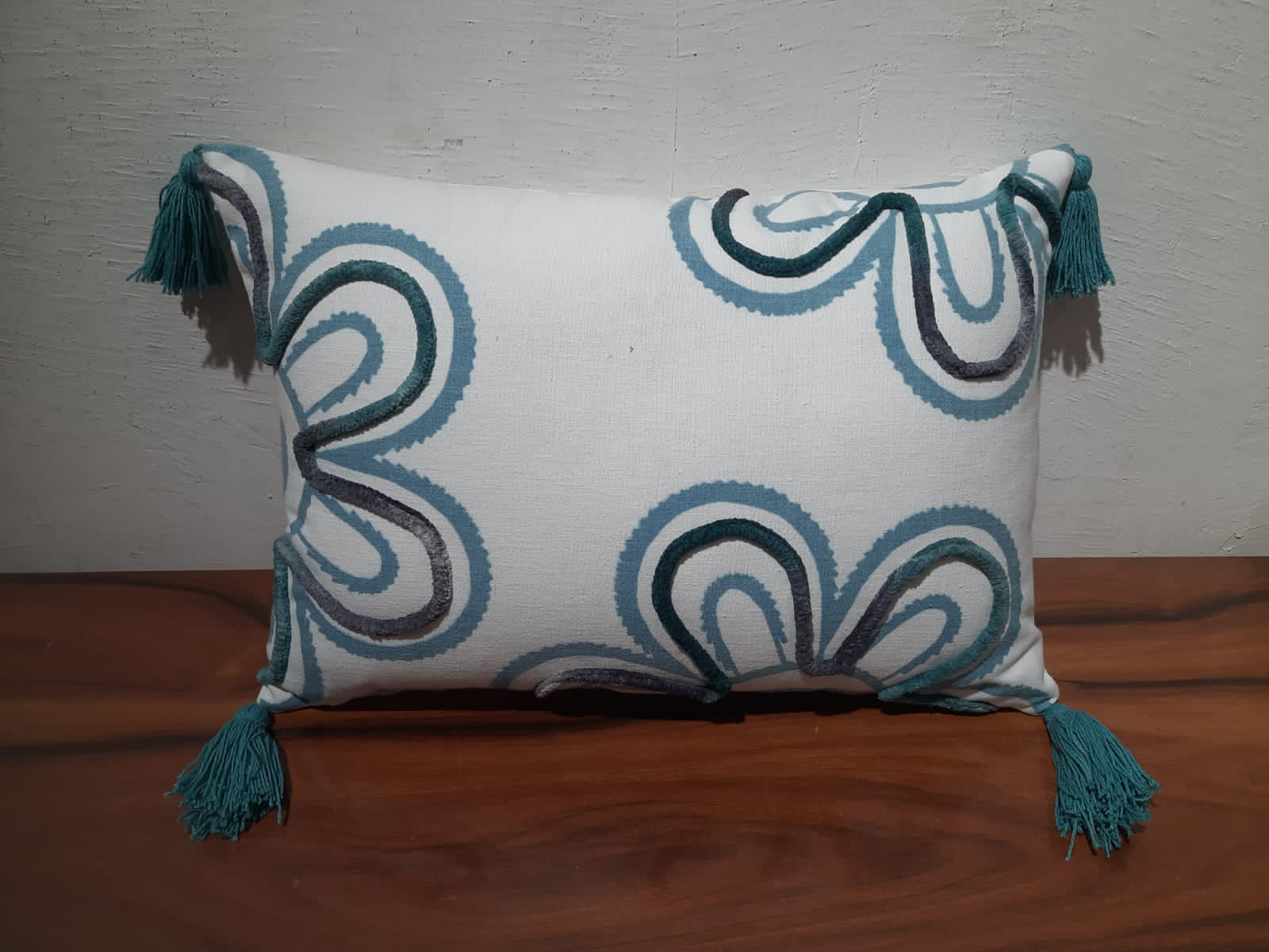about decorative oblong pillows with hand embroidry , print , lace work